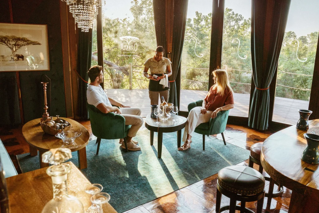A couple enjoying a private wine tasting experience at Atzaró Okavango, surrounded by the natural beauty of the Delta.