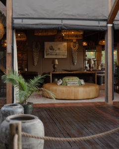 Main area of Atzaró Okavango Camp in Botswana with natural materials and indoor-outdoor living.