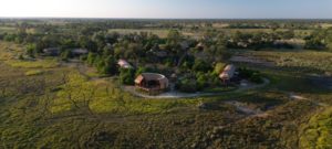 Aerial view of Atzaró Okavango Camp in the Okavango Delta, Botswana, surrounded by untouched wilderness and eco-luxury safari lodges.