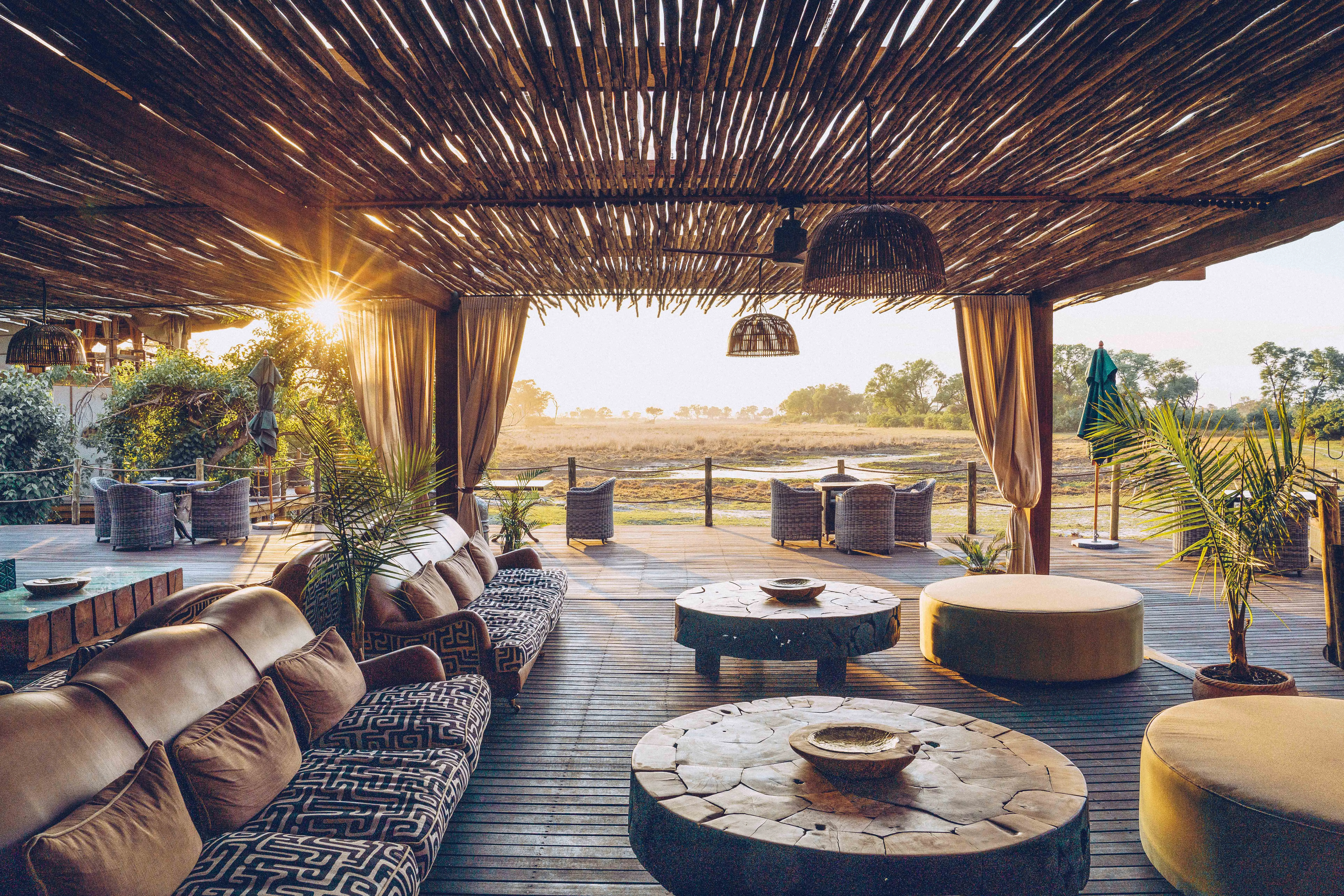 Relaxation area with an observation deck and the savanna in the background at Atzaró Okavango Camp.