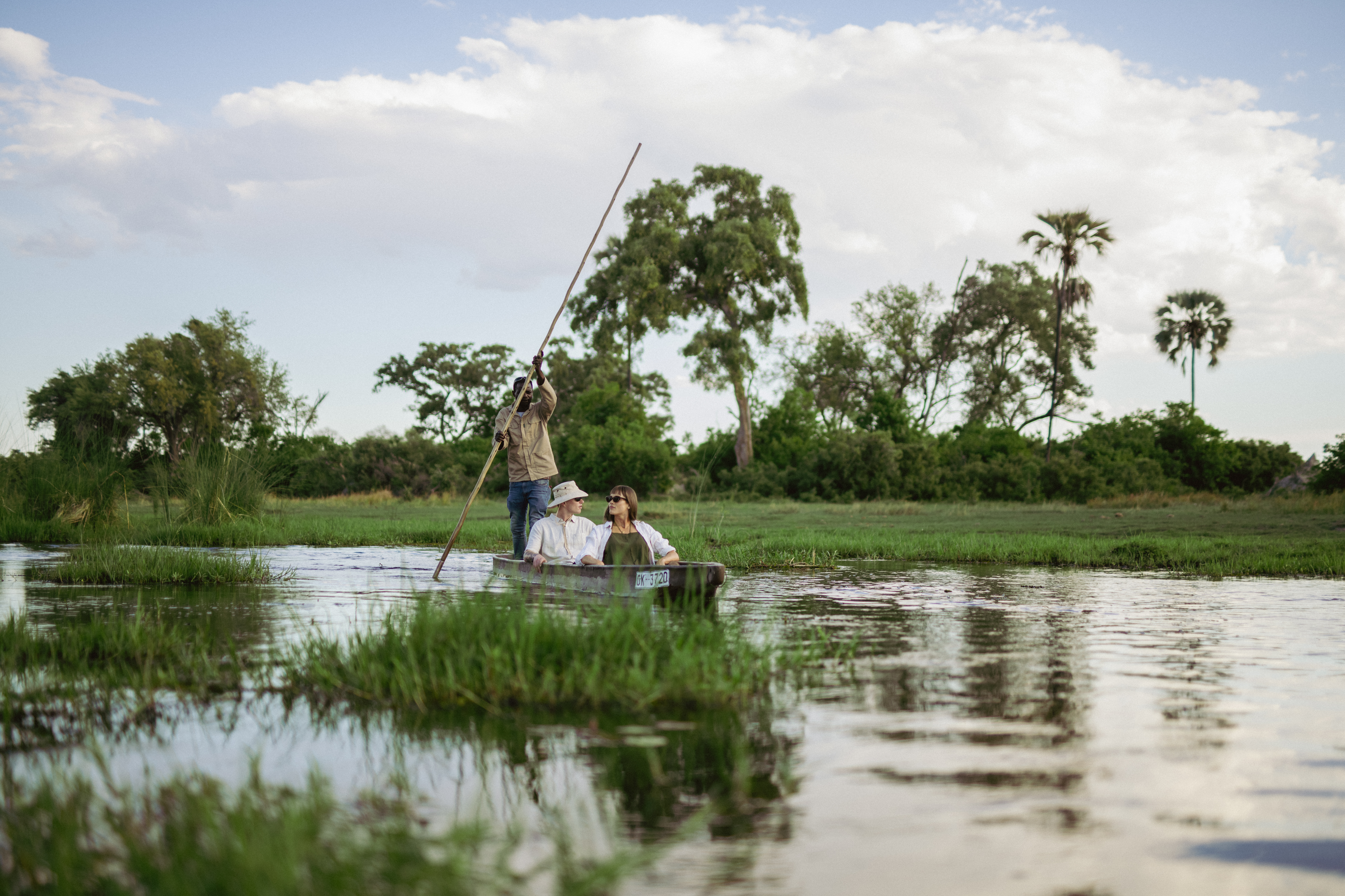A couple enjoying a private Mokoro Safari.