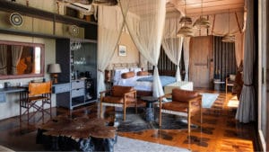 Safari tent suite at Atzaró Okavango with a minibar, tea and espresso station and guest amenities